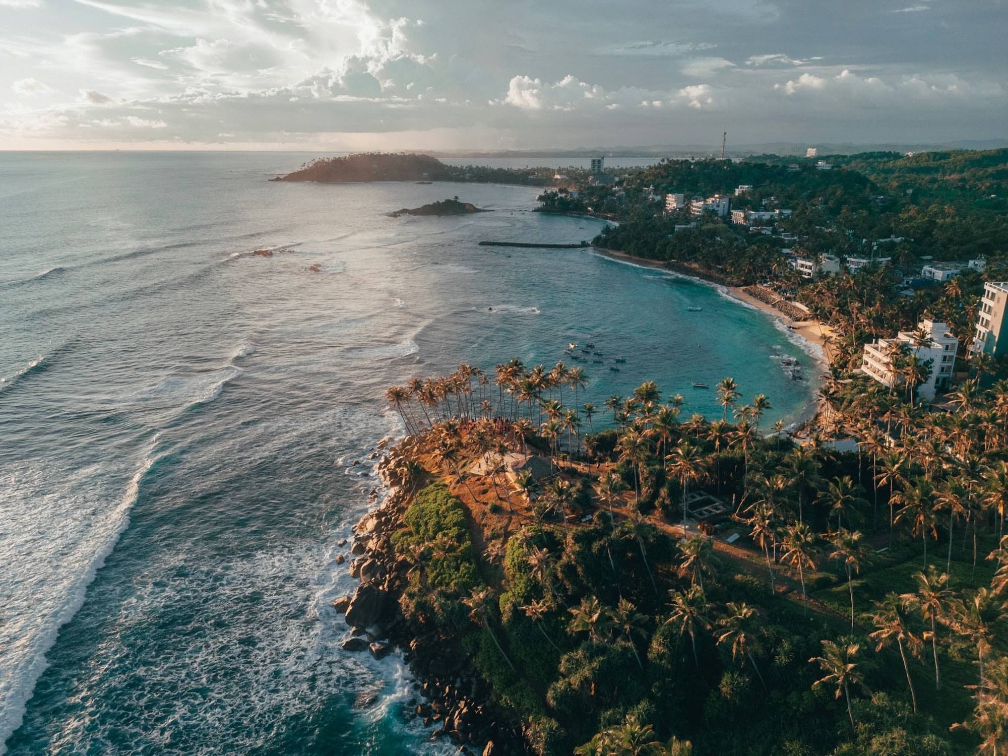 Aerial view of the turquoise crescent at Mirissa Beach on Sri Lanka’s south coast